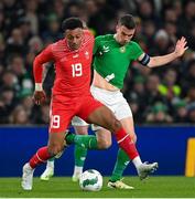 26 March 2024; Dan Ndoye of Switzerland in action against Seamus Coleman of Republic of Ireland during the international friendly match between Republic of Ireland and Switzerland at the Aviva Stadium in Dublin. Photo by Stephen McCarthy/Sportsfile