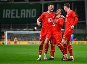 26 March 2024; Xherdan Shaqiri of Switzerland celebrates with teammates Granit Xhaka and Michel Aebischer after scoring their side's first goal during the international friendly match between Republic of Ireland and Switzerland at the Aviva Stadium in Dublin. Photo by Tyler Miller/Sportsfile