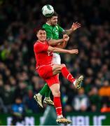 26 March 2024; Robbie Brady of Republic of Ireland in action against Vincent Sierro of Switzerland during the international friendly match between Republic of Ireland and Switzerland at the Aviva Stadium in Dublin. Photo by Stephen McCarthy/Sportsfile