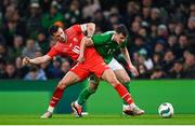 26 March 2024; Jason Knight of Republic of Ireland in action against Granit Xhaka of Switzerland during the international friendly match between Republic of Ireland and Switzerland at the Aviva Stadium in Dublin. Photo by Tyler Miller/Sportsfile