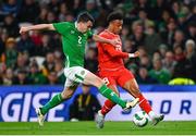 26 March 2024; Dan Ndoye of Switzerland in action against Seamus Coleman of Republic of Ireland during the international friendly match between Republic of Ireland and Switzerland at the Aviva Stadium in Dublin. Photo by Tyler Miller/Sportsfile