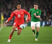 26 March 2024; Dan Ndoye of Switzerland in action against Seamus Coleman of Republic of Ireland during the international friendly match between Republic of Ireland and Switzerland at the Aviva Stadium in Dublin. Photo by David Fitzgerald/Sportsfile