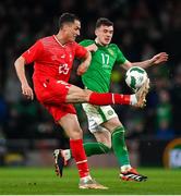 26 March 2024; Xherdan Shaqiri of Switzerland in action against Jason Knight of Republic of Ireland during the international friendly match between Republic of Ireland and Switzerland at the Aviva Stadium in Dublin. Photo by Stephen McCarthy/Sportsfile