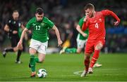 26 March 2024; Jason Knight of Republic of Ireland in action against Nico Elvedi of Switzerland during the international friendly match between Republic of Ireland and Switzerland at the Aviva Stadium in Dublin. Photo by David Fitzgerald/Sportsfile
