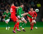 26 March 2024; Evan Ferguson of Republic of Ireland in action against Fabian Schär of Switzerland during the international friendly match between Republic of Ireland and Switzerland at the Aviva Stadium in Dublin. Photo by Stephen McCarthy/Sportsfile