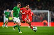 26 March 2024; Seamus Coleman of Republic of Ireland in action against Dan Ndoye of Switzerland during the international friendly match between Republic of Ireland and Switzerland at the Aviva Stadium in Dublin. Photo by Tyler Miller/Sportsfile