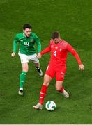 26 March 2024; Nico Elvedi of Switzerland in action against Mikey Johnston of Republic of Ireland during the international friendly match between Republic of Ireland and Switzerland at the Aviva Stadium in Dublin. Photo by Michael P Ryan/Sportsfile