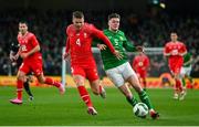 26 March 2024; Nico Elvedi of Switzerland in action against Evan Ferguson of Republic of Ireland during the international friendly match between Republic of Ireland and Switzerland at the Aviva Stadium in Dublin. Photo by Stephen McCarthy/Sportsfile