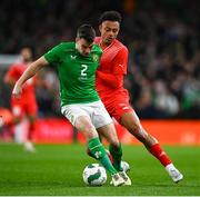 26 March 2024; Seamus Coleman of Republic of Ireland in action against Dan Ndoye of Switzerland during the international friendly match between Republic of Ireland and Switzerland at the Aviva Stadium in Dublin. Photo by Tyler Miller/Sportsfile