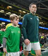 26 March 2024; Republic of Ireland captain Seamus Coleman leads his side out before the international friendly match between Republic of Ireland and Switzerland at the Aviva Stadium in Dublin. Photo by Stephen McCarthy/Sportsfile