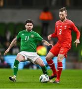 26 March 2024; Silvan Widmer of Switzerland in action against Robbie Brady of Republic of Ireland during the international friendly match between Republic of Ireland and Switzerland at the Aviva Stadium in Dublin. Photo by Ben McShane/Sportsfile