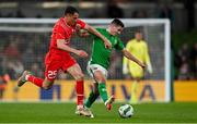 26 March 2024; Josh Cullen of Republic of Ireland in action against Vincent Sierro of Switzerland during the international friendly match between Republic of Ireland and Switzerland at the Aviva Stadium in Dublin. Photo by Stephen McCarthy/Sportsfile
