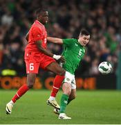 26 March 2024; Josh Cullen of Republic of Ireland is tackled by Denis Zakaria of Switzerland during the international friendly match between Republic of Ireland and Switzerland at the Aviva Stadium in Dublin. Photo by David Fitzgerald/Sportsfile