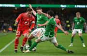 26 March 2024; Xherdan Shaqiri of Switzerland is tackled by Dara O'Shea and Robbie Brady, right, of Republic of Ireland during the international friendly match between Republic of Ireland and Switzerland at the Aviva Stadium in Dublin. Photo by David Fitzgerald/Sportsfile