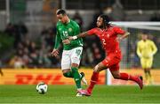 26 March 2024; Adam Idah of Republic of Ireland in action against Kevin Mbabu of Switzerland during the international friendly match between Republic of Ireland and Switzerland at the Aviva Stadium in Dublin. Photo by Ben McShane/Sportsfile