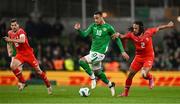26 March 2024; Adam Idah of Republic of Ireland in action against Remo Freuler, left, and Kevin Mbabu of Switzerland during the international friendly match between Republic of Ireland and Switzerland at the Aviva Stadium in Dublin. Photo by Ben McShane/Sportsfile