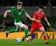 26 March 2024; Nathan Collins of Republic of Ireland in action against Zeki Amdouni of Switzerland during the international friendly match between Republic of Ireland and Switzerland at the Aviva Stadium in Dublin. Photo by Stephen McCarthy/Sportsfile