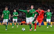 26 March 2024; Matt Doherty of Republic of Ireland in action against Noah Okafor of Switzerland during the international friendly match between Republic of Ireland and Switzerland at the Aviva Stadium in Dublin. Photo by Tyler Miller/Sportsfile