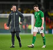 26 March 2024; Republic of Ireland assistant coach Glenn Whelan, left, and Dara O'Shea after the international friendly match between Republic of Ireland and Switzerland at the Aviva Stadium in Dublin. Photo by Ben McShane/Sportsfile