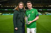 26 March 2024; Sky Ireland chief operating officer Orlaith Ryan presents Seamus Coleman of Republic of Ireland with the Sky Player of the Match award after the international friendly match between Republic of Ireland and Switzerland at the Aviva Stadium in Dublin. Photo by Stephen McCarthy/Sportsfile
