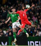 26 March 2024; Kevin Mbabu of Switzerland in action against Callum O'Dowda of Republic of Ireland during the international friendly match between Republic of Ireland and Switzerland at the Aviva Stadium in Dublin. Photo by Stephen McCarthy/Sportsfile