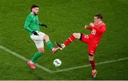 26 March 2024; Matt Doherty of Republic of Ireland in action against Michel Aebischer of Switzerland during the international friendly match between Republic of Ireland and Switzerland at the Aviva Stadium in Dublin. Photo by Michael P Ryan/Sportsfile