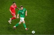 26 March 2024; Nathan Collins of Republic of Ireland in action against Noah Okafor of Switzerland during the international friendly match between Republic of Ireland and Switzerland at the Aviva Stadium in Dublin. Photo by Michael P Ryan/Sportsfile