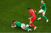 26 March 2024; Seamus Coleman of Republic of Ireland is tackled by Noah Okafor of Switzerland during the international friendly match between Republic of Ireland and Switzerland at the Aviva Stadium in Dublin. Photo by Michael P Ryan/Sportsfile