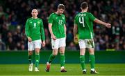26 March 2024; Republic of Ireland players, from left, Will Smallbone, Nathan Collins and Dara O'Shea react during the international friendly match between Republic of Ireland and Switzerland at the Aviva Stadium in Dublin. Photo by Tyler Miller/Sportsfile