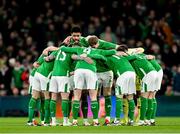 26 March 2024; Andrew Omobamidele and Republic of Ireland team-mates huddle before the international friendly match between Republic of Ireland and Switzerland at the Aviva Stadium in Dublin. Photo by Stephen McCarthy/Sportsfile