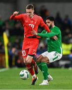 26 March 2024; Michel Aebischer of Switzerland is tackled by Andrew Omobamidele of Republic of Ireland during the international friendly match between Republic of Ireland and Switzerland at the Aviva Stadium in Dublin. Photo by Stephen McCarthy/Sportsfile