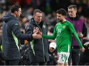 26 March 2024; Mikey Johnston of Republic of Ireland with goalkeeping coach Rene Gilmartin, left, and assistant coach Glenn Whelan during the international friendly match between Republic of Ireland and Switzerland at the Aviva Stadium in Dublin. Photo by Stephen McCarthy/Sportsfile