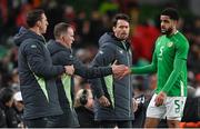 26 March 2024; Andrew Omobamidele of Republic of Ireland with coaches, from left, goalkeeping coach Rene Gilmartin, assistant coach Glenn Whelan and assistant coach Paddy McCarthy during the international friendly match between Republic of Ireland and Switzerland at the Aviva Stadium in Dublin. Photo by Stephen McCarthy/Sportsfile