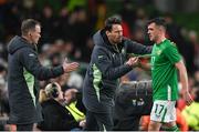 26 March 2024; Jason Knight of Republic of Ireland with assistant coach Paddy McCarthy and assistant coach Glenn Whelan, left, during the international friendly match between Republic of Ireland and Switzerland at the Aviva Stadium in Dublin. Photo by Stephen McCarthy/Sportsfile