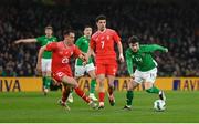 26 March 2024; Mikey Johnston of Republic of Ireland in action against Vincent Sierro, left, and Zeki Amdouni of Switzerland during the international friendly match between Republic of Ireland and Switzerland at the Aviva Stadium in Dublin. Photo by Stephen McCarthy/Sportsfile