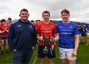 27 March 2024; North East captain Conor Goodwin and North Midlands captain Eanna Moynihan are presented with the cup by Ireland international and Leinster player Tadhg Furlong after the BearingPoint Shane Horgan Cup Round 5 match between Midlands and North East at Carlow Institute of Technology in Carlow. Photo by Tyler Miller/Sportsfile
