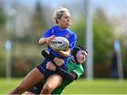 27 March 2024; Emma Henry of North Midlands is tackled by Eva Nolan of South East during the BearingPoint Sarah Robinson Cup Round 5 match between South East and North Midlands at Carlow Institute of Technology in Carlow. Photo by Tyler Miller/Sportsfile