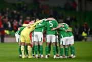 26 March 2024; Republic of Ireland players huddle before the international friendly match between Republic of Ireland and Switzerland at the Aviva Stadium in Dublin. Photo by Ben McShane/Sportsfile