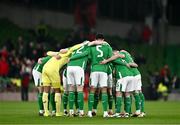 26 March 2024; Republic of Ireland players huddle before the international friendly match between Republic of Ireland and Switzerland at the Aviva Stadium in Dublin. Photo by Ben McShane/Sportsfile