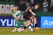 29 March 2024; Dylan Connolly of Bohemians in action against Lee Grace of Shamrock Rovers during the SSE Airtricity Men's Premier Division match between Shamrock Rovers and Bohemians at Tallaght Stadium in Dublin. Photo by Stephen McCarthy/Sportsfile