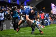 29 March 2024; James Lowe of Leinster scores his side's third try, despite the tackle of Embrose Papier of Vodacom Bulls, during the United Rugby Championship match between Leinster and Vodacom Bulls at the RDS Arena in Dublin. Photo by Seb Daly/Sportsfile