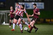 29 March 2024; Shane McEleney of Derry City in action against Karl O'Sullivan of Galway United during the SSE Airtricity Men's Premier Division match between Derry City and Galway United at The Ryan McBride Brandywell Stadium in Derry. Photo by Ben McShane/Sportsfile
