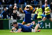 29 March 2024; Jack Conan of Leinster dives over to score his side's sixth try despite the tackle of Devon Williams of Vodacom Bulls during the United Rugby Championship match between Leinster and Vodacom Bulls at the RDS Arena in Dublin. Photo by Harry Murphy/Sportsfile