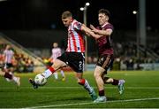 29 March 2024; Ronan Boyce of Derry City in action against Edward McCarthy of Galway United during the SSE Airtricity Men's Premier Division match between Derry City and Galway United at The Ryan McBride Brandywell Stadium in Derry. Photo by Ben McShane/Sportsfile