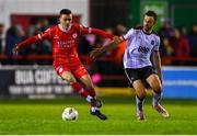 29 March 2024; Dean Williams of Shelbourne in action against Robbie Benson of Dundalk during the SSE Airtricity Men's Premier Division match between Shelbourne and Dundalk at Tolka Park in Dublin. Photo by Tyler Miller/Sportsfile