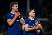 29 March 2024; Leinster players Jordan Larmour, right, and Caelan Doris after their side's victory in the United Rugby Championship match between Leinster and Vodacom Bulls at the RDS Arena in Dublin. Photo by Seb Daly/Sportsfile