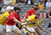 25 July 2004; Wayne Sherlock, Cork, is tackled by Antrim's Colm McGuckian, left, and Brian McFall. Guinness All-Ireland Senior Hurlingsupported by Brian Murphy,  Championship, Quarter Final, Antrim v Cork, Croke Park, Dublin. Picture credit; Ray McManus / SPORTSFILE