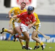 25 July 2004; Kieran Murphy, Cork, is tackled by Antrim's Jim Connolly, left, and Michael Magill. Guinness All-Ireland Senior Hurling Championship, Quarter Final, Antrim v Cork, Croke Park, Dublin. Picture credit; Brian Lawless / SPORTSFILE