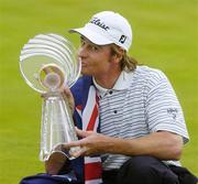 25 July 2004; Brett Rumford kisses the trophy after his victory. Nissan Irish Open Golf Championship, County Louth Golf Club, Baltray, Co. Louth. Picture credit; Matt Browne / SPORTSFILE