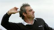 25 July 2004; Paul McGinley throws a ball into the crowd after finishing on the 18th green during the fourth round. Nissan Irish Open Golf Championship, County Louth Golf Club, Baltray, Co. Louth. Picture credit; Matt Browne / SPORTSFILE